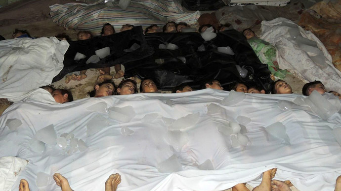 A handout image released by the Syrian opposition's Shaam News Network shows bodies of children laid out on the ground in a makeshift morgue as Syrian rebels claim they were killed in a toxic gas attack by pro-government forces in eastern Ghouta, on the outskirts of Damascus on August 21, 2013. (AFP/Shaam News Network)